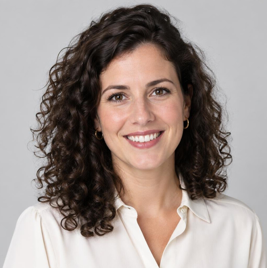 Studio portrait of a young Belgian woman with curly hair